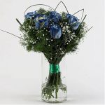BLUE SHADE ROSES IN GLASS VASE
