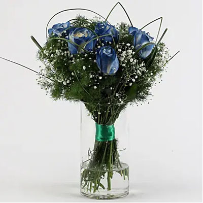 BLUE SHADE ROSES IN GLASS VASE