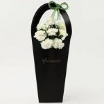 8 White Carnations in Black FNP Sleeve Bag